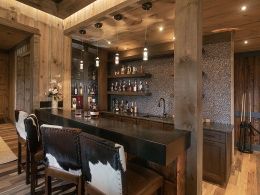 Bar with Custom cowhide upholstered bar stools compliment this well stocked bar in Blairsville Georgia.