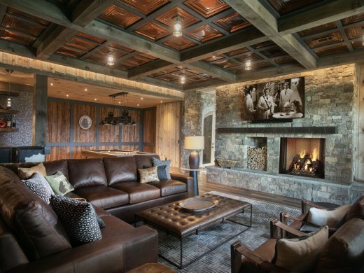 Blue Mist Custom Home Family Bar 3 Wood. The ashlar stone fireplace warms up the family room. Check out the coffered ceiling detail, adding a bold pattern to this luxury custom home in Blairsville Georgia