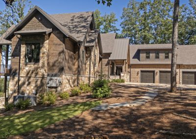 Blue Mist Custom Home Three car garage attached to custom home in Blairsville Georgia. The gabled roof lines mimic the peaks of the Appalachian Mountains for this custom home.