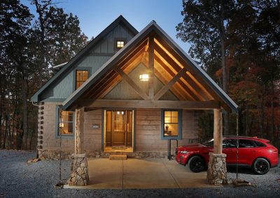 Modern custom home exterior at dusk in Jasper, Georgia by Modern Rustic Homes.