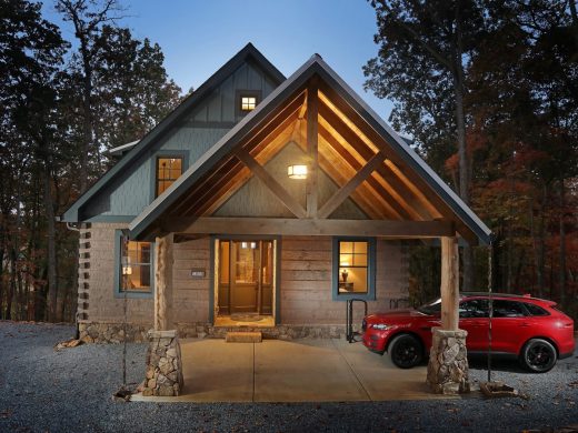 Modern custom home exterior at dusk in Jasper, Georgia by Modern Rustic Homes.