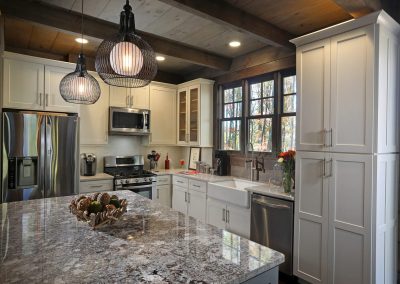 Custom rustic kitchen with exposed wood beam ceiling in Jasper, Georgia by Modern Rustic Homes