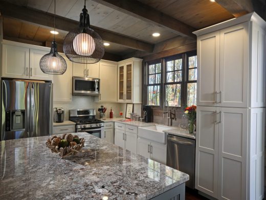 Custom rustic kitchen with exposed wood beam ceiling in Jasper, Georgia by Modern Rustic Homes