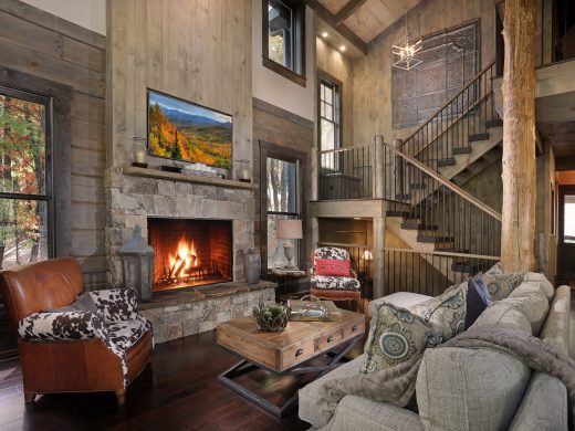 Rustic staircase overlooking great room interior in Jasper, Georgia by Modern Rustic Homes