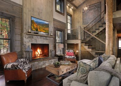Modern rustic interior living room with vertical wood planks and stone fireplace in Jasper, Georgia by Modern Rustic Homes