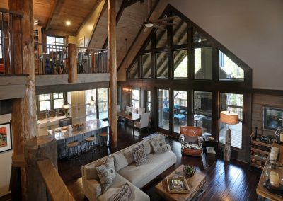 Open concept kitchen island overlooking vaulted great room in Jasper, Georgia by Modern Rustic Homes