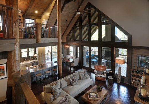 Open concept kitchen island overlooking vaulted great room in Jasper, Georgia by Modern Rustic Homes