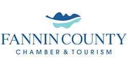 Fannin County Chamber & Tourism logo with blue mountains above a teal wave and the text 'FANNIN COUNTY CHAMBER & TOURISM'.