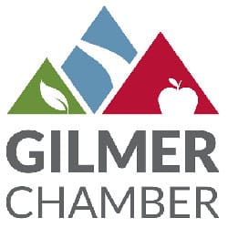 Gilmer Chamber logo with stylized blue, green, and red mountains, a leaf and an apple, plus the text 'GILMER CHAMBER'