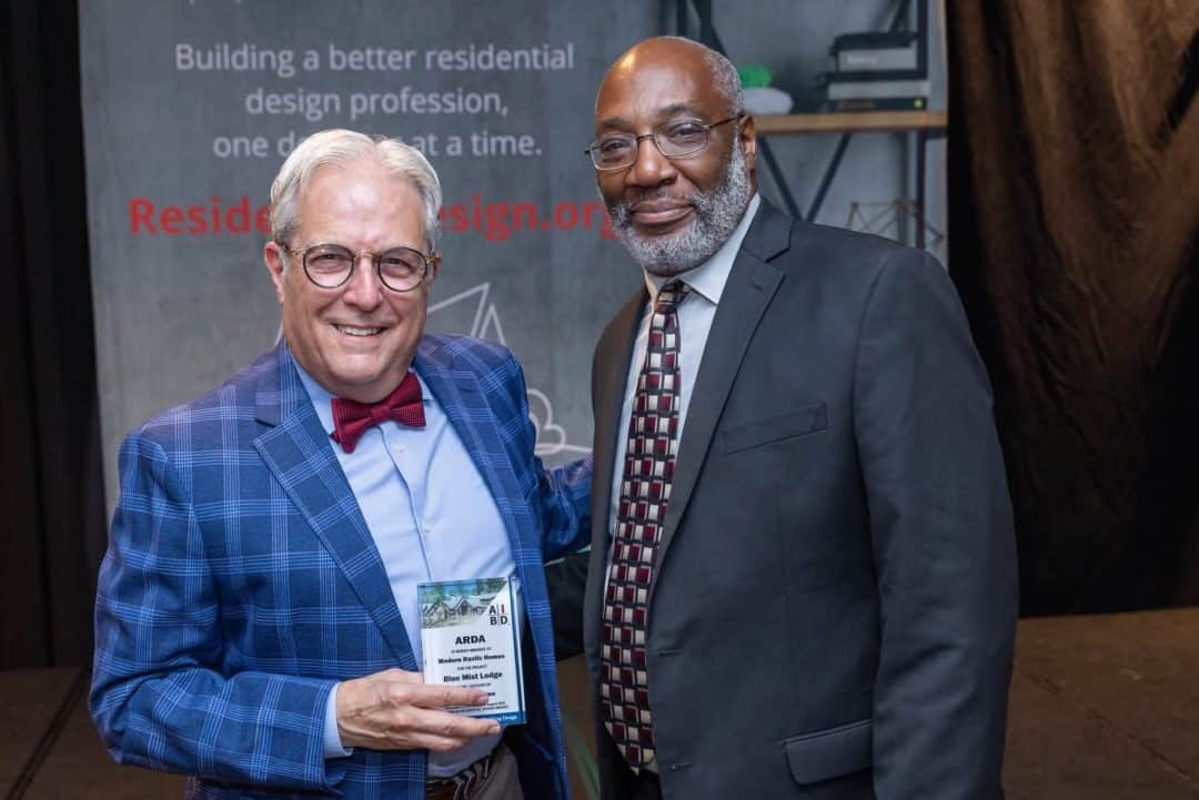Michael Grant accepting the 2026 ARDA Award for Blue Mist Lodge from the American Institute of Building Design.